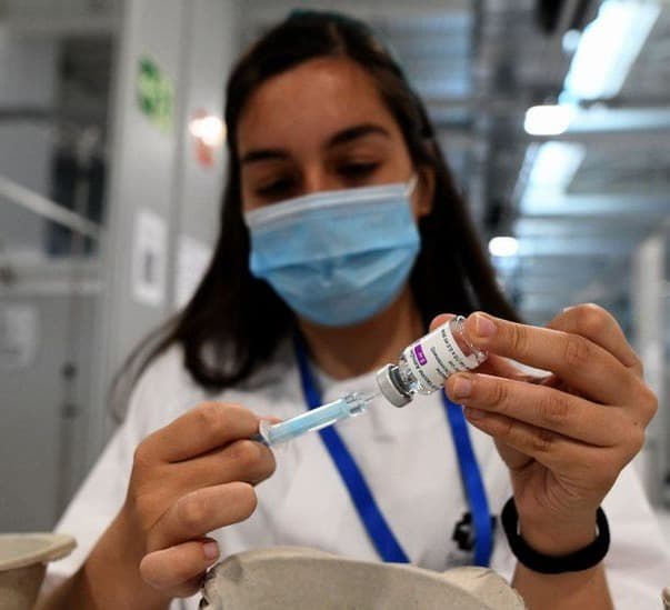 Merkel defends rollout as vaccine pressure grows