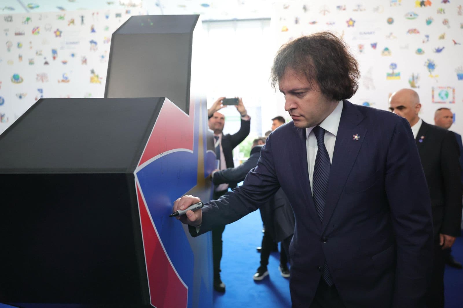 <p><span style="color: rgb(0, 0, 0)">Georgian Prime Minister Irakli Kobakhidze is attending the 6th European Political Union (EPC) Summit in Tirana, Albania, on the invitation of Antonio Costa, President of the European Council. The summit, hosted by the Albanian Prime Minister, brings together leaders from approximately 50 countries, alongside heads of European and international institutions.</span></p><p><span style="color: rgb(0, 0, 0)">Kobakhidze, accompanied by Foreign Minister Maka Botchorishvili and Head of Government Administration Levan Zhorzholiani, participated in the summit’s opening session, which was followed by a joint photo of all attending leaders.</span></p><p><span style="color: rgb(0, 0, 0)">He is scheduled to deliver a speech at the summit in a round table format, where he intends to “</span><a target="_blank" rel="noopener noreferrer nofollow" class="text-brand-500 underline" href="https://frontnews.ge/en/news/irakli-kobakhidze-evropuli-politikuri-gaertianebis-samitze-evropidan-qvela-kveqnis-lideri-ikneba-tsarmodgenili-saubari-gvekneba-chveni-kveqnis-mtavar-gzavnilebze"><span style="color: rgb(0, 0, 0)">highlight Georgia’s key national interests</span></a><span style="color: rgb(0, 0, 0)">.” Speaking ahead of his address, Kobakhidze emphasized the importance of using the opportunity to engage with other European leaders on issues crucial to Georgia.</span></p><p><span style="color: rgb(0, 0, 0)">"The summit will be attended by leaders from all European countries. I will have the opportunity to deliver a speech in a round table format. We will also use this format to talk to leaders of different countries. Naturally, we will talk about the main messages of our country, which are related to our fundamental national interests," Kobakhidze pledged.</span></p><p><span style="color: rgb(0, 0, 0)">The European Political Union Summit serves as a platform for European leaders to discuss key issues affecting the continent, with a focus on enhancing cooperation and addressing common challenges.&nbsp;</span></p><p><br></p>